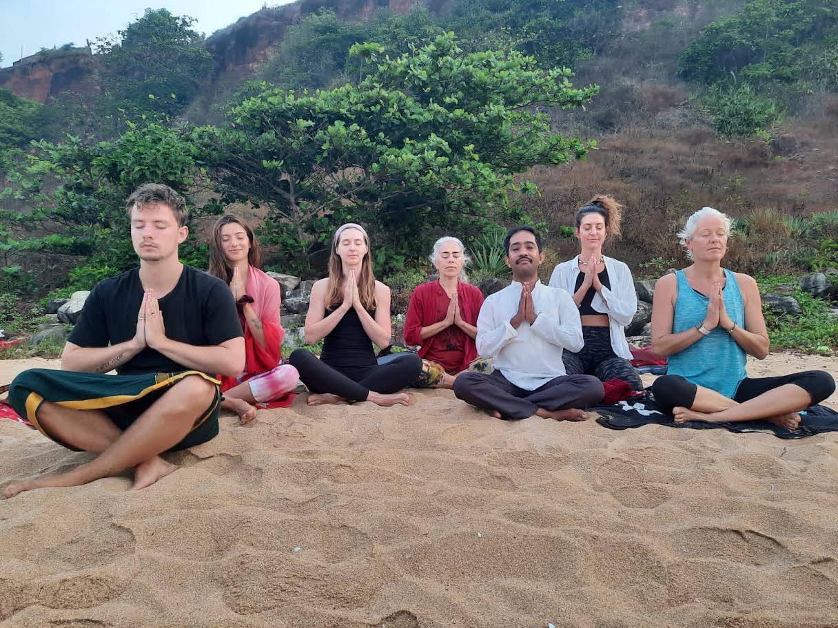 Yoga asana practice at a Kerala retreat